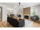 Open-concept living room flowing into dining area, with modern decor, fireplace, and ample natural light at 126 Marona Ne St, Atlanta, GA 30307