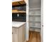 Organized pantry with shelves, marble countertop, and wood tile at 126 Marona Ne St, Atlanta, GA 30307