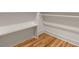 Spacious walk-in closet with custom shelving and hardwood floors at 126 Marona Ne St, Atlanta, GA 30307