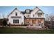 Striking two-story home with a brick facade, covered porch, and meticulously landscaped front yard at 2480 Bleckley Pl, Cumming, GA 30041