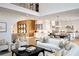 Open-concept layout with a living room, dining area, and kitchen featuring modern finishes at 2480 Bleckley Pl, Cumming, GA 30041