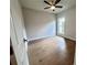 This bright bedroom features a ceiling fan and hardwood floors at 285 Briscoe Way # 2, Alpharetta, GA 30009
