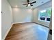 Bedroom with hardwood floors, ceiling fan, recessed lighting, and a large window at 285 Briscoe Way # 2, Alpharetta, GA 30009