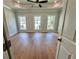 Spacious bedroom with tray ceiling, hardwood floors, and large windows at 285 Briscoe Way # 2, Alpharetta, GA 30009