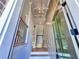 Bright entryway features modern chandelier and stylish front door at 285 Briscoe Way # 2, Alpharetta, GA 30009