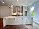Bright, modern kitchen with stainless steel appliances, gray cabinets and large island with pendant lighting at 285 Briscoe Way # 2, Alpharetta, GA 30009