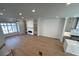 The spacious living room features a cozy fireplace, custom built-in shelves, and hardwood floors at 285 Briscoe Way # 2, Alpharetta, GA 30009