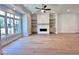 Bright living room features a cozy fireplace with built-in shelves and a large window at 285 Briscoe Way # 2, Alpharetta, GA 30009