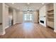The expansive living room features hardwood floors and a cozy fireplace at 285 Briscoe Way # 2, Alpharetta, GA 30009