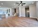 Spacious living room features hardwood floors and modern ceiling fan at 285 Briscoe Way # 2, Alpharetta, GA 30009