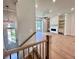 Bright and airy living room features a fireplace, built-in shelves, and hardwood floors at 285 Briscoe Way # 2, Alpharetta, GA 30009