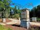 Entrance to Alpharetta Street Park, featuring stone columns, landscaping, and a welcoming archway at 285 Briscoe Way # 2, Alpharetta, GA 30009