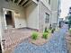 Brick patio with gravel and brick walkway leading to townhome entrance and staircase at 285 Briscoe Way # 2, Alpharetta, GA 30009