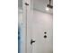 This shower features white tiled walls and modern, black hardware at 285 Briscoe Way # 2, Alpharetta, GA 30009