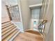 Open staircase with hardwood steps and railings leads down to the entry at 285 Briscoe Way # 2, Alpharetta, GA 30009