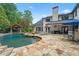 The large backyard is an entertainer's dream, featuring a pool, patio, gazebo, and ample space at 4030 River Ridge Se, Marietta, GA 30067