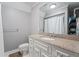 Bathroom featuring white vanity with granite countertop and toilet at 4030 River Ridge Se, Marietta, GA 30067