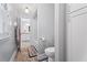 Hallway to bathroom with walk-in shower and toilet; tile flooring at 4030 River Ridge Se, Marietta, GA 30067