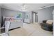 Bright bedroom with light gray walls and a seating area with a round chair at 4030 River Ridge Se, Marietta, GA 30067