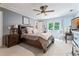 Bedroom featuring blue walls, a dark wood bed frame, and a desk at 4030 River Ridge Se, Marietta, GA 30067
