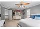 Bedroom with neutral carpet, gray walls, ceiling fan, and attached bathroom at 4030 River Ridge Se, Marietta, GA 30067