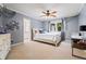 Bedroom featuring neutral carpet, gray walls, and a ceiling fan at 4030 River Ridge Se, Marietta, GA 30067