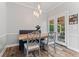 Cozy breakfast nook with banquette seating, decorative lighting, and access to an outdoor patio at 4030 River Ridge Se, Marietta, GA 30067