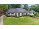Beautiful home showcasing well-manicured lawn, lush landscaping, and a charming exterior design at 4030 River Ridge Se, Marietta, GA 30067