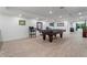 Bright basement game room, recessed lighting and light tile floors offer a modern and entertaining space for recreation at 4030 River Ridge Se, Marietta, GA 30067