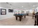 Basement game room features a pool table, bar area, and a modern finish for ultimate entertainment at 4030 River Ridge Se, Marietta, GA 30067