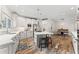 Bright kitchen with stainless steel appliances, white cabinets and a center island with barstool seating at 4030 River Ridge Se, Marietta, GA 30067