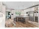 Spacious kitchen features stainless steel appliances, white cabinets and an island with bar seating at 4030 River Ridge Se, Marietta, GA 30067
