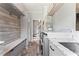 Functional laundry room features granite countertop, gray cabinets and drawers and a washing machine at 4030 River Ridge Se, Marietta, GA 30067
