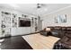Bright living room featuring built-in shelving, dark wood floors and comfortable seating with an area rug at 4030 River Ridge Se, Marietta, GA 30067