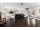 Expansive living room with built-in shelves, dark wood floors, recessed lighting, and a stone fireplace at 4030 River Ridge Se, Marietta, GA 30067