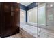 Main bathroom featuring a soaking tub, shower, and a large cabinet at 4030 River Ridge Se, Marietta, GA 30067