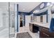 Main bathroom boasts a walk-in shower, granite countertops, and blue walls at 4030 River Ridge Se, Marietta, GA 30067