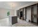 This walk-in closet features a center island, custom shelving, and great lighting at 4030 River Ridge Se, Marietta, GA 30067