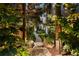 Lush backyard landscape featuring serene walkways, large rocks, trees and greenery with natural accents at 1242 Wild Creek Ne Trl, Atlanta, GA 30324