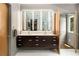 Bathroom with double vanity, ample cabinet space, and modern lighting at 1242 Wild Creek Ne Trl, Atlanta, GA 30324