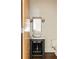 Bathroom with a marble vessel sink, chrome faucet, framed mirror, and a modern toilet at 1242 Wild Creek Ne Trl, Atlanta, GA 30324
