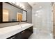 Modern bathroom with a sleek vanity, elegant fixtures, a glass-enclosed shower, and neutral tones at 1242 Wild Creek Ne Trl, Atlanta, GA 30324