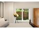 Comfortable bedroom featuring soft white linens, a window view, and a modern floor lamp at 1242 Wild Creek Ne Trl, Atlanta, GA 30324