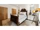 Cozy bedroom with classic wood furniture, soft lighting, and a decorative mirror adding elegance to the space at 1242 Wild Creek Ne Trl, Atlanta, GA 30324