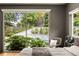 Bedroom window view of a pool and tiered backyard with well-manicured landscaping at 1242 Wild Creek Ne Trl, Atlanta, GA 30324