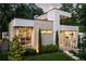 Modern two-story home featuring a garden and stone steps leading to the front door at 1242 Wild Creek Ne Trl, Atlanta, GA 30324