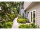 Beautifully landscaped yard surrounding the house, with a pathway leading to the entrance with well placed vegetation at 1242 Wild Creek Ne Trl, Atlanta, GA 30324