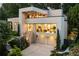 Modern home with a two-car garage, balcony, manicured landscaping and large windows at 1242 Wild Creek Ne Trl, Atlanta, GA 30324