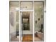 Elegant foyer with glass door and decorative accents, offering a glimpse into the home's stylish interior at 1242 Wild Creek Ne Trl, Atlanta, GA 30324