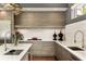 Modern kitchen with stainless steel appliances, sleek cabinets, and designer lighting at 1242 Wild Creek Ne Trl, Atlanta, GA 30324